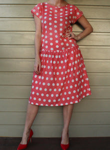 Pink dress with white polka dots