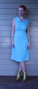 Baby blue 60’s/70’s dress with buttons down the front and lace around the waist