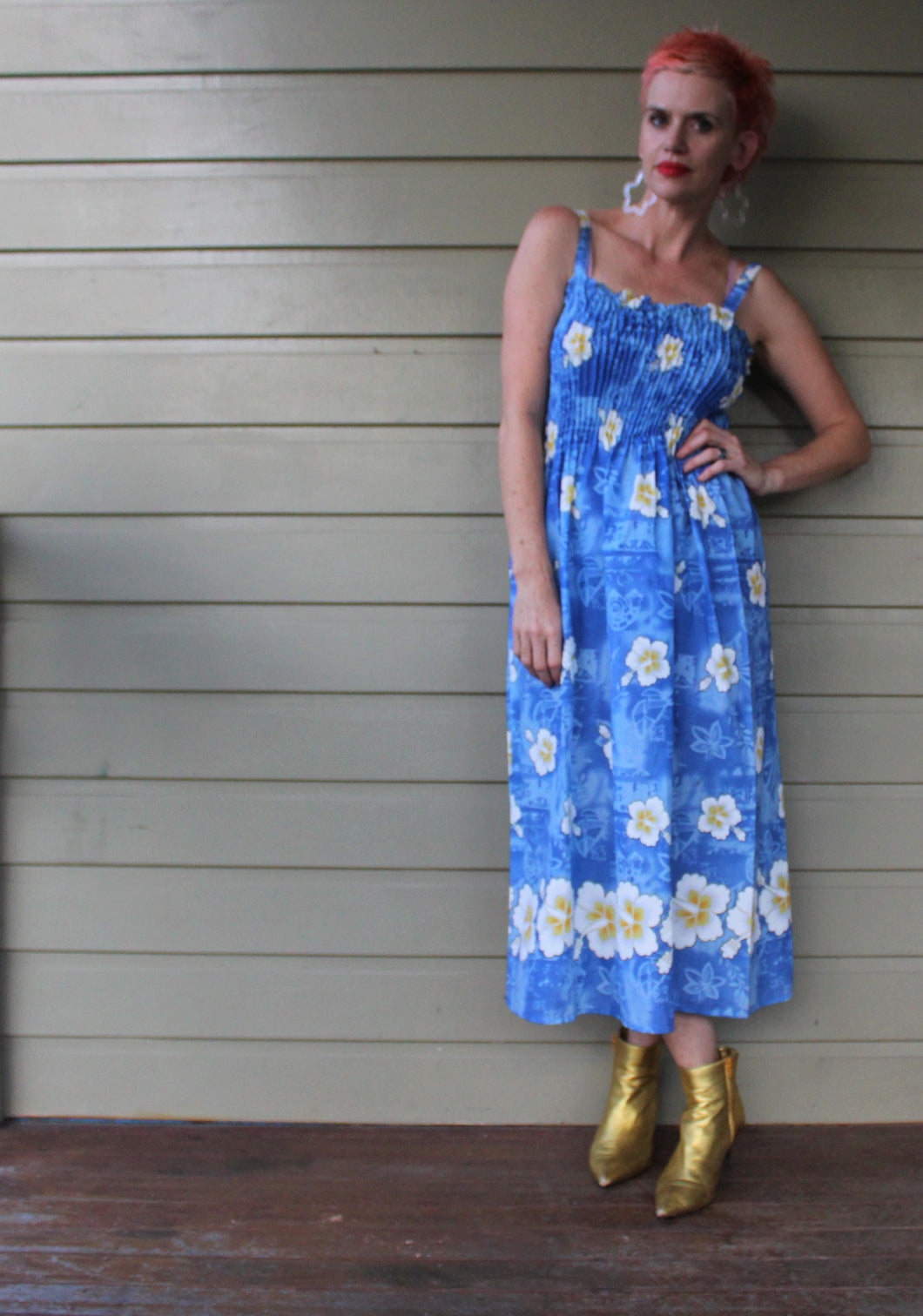 Blue Hawaiian style dress with frangipani flowers pattern